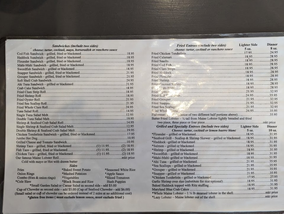 Printed seafood menu with chowders and salads.